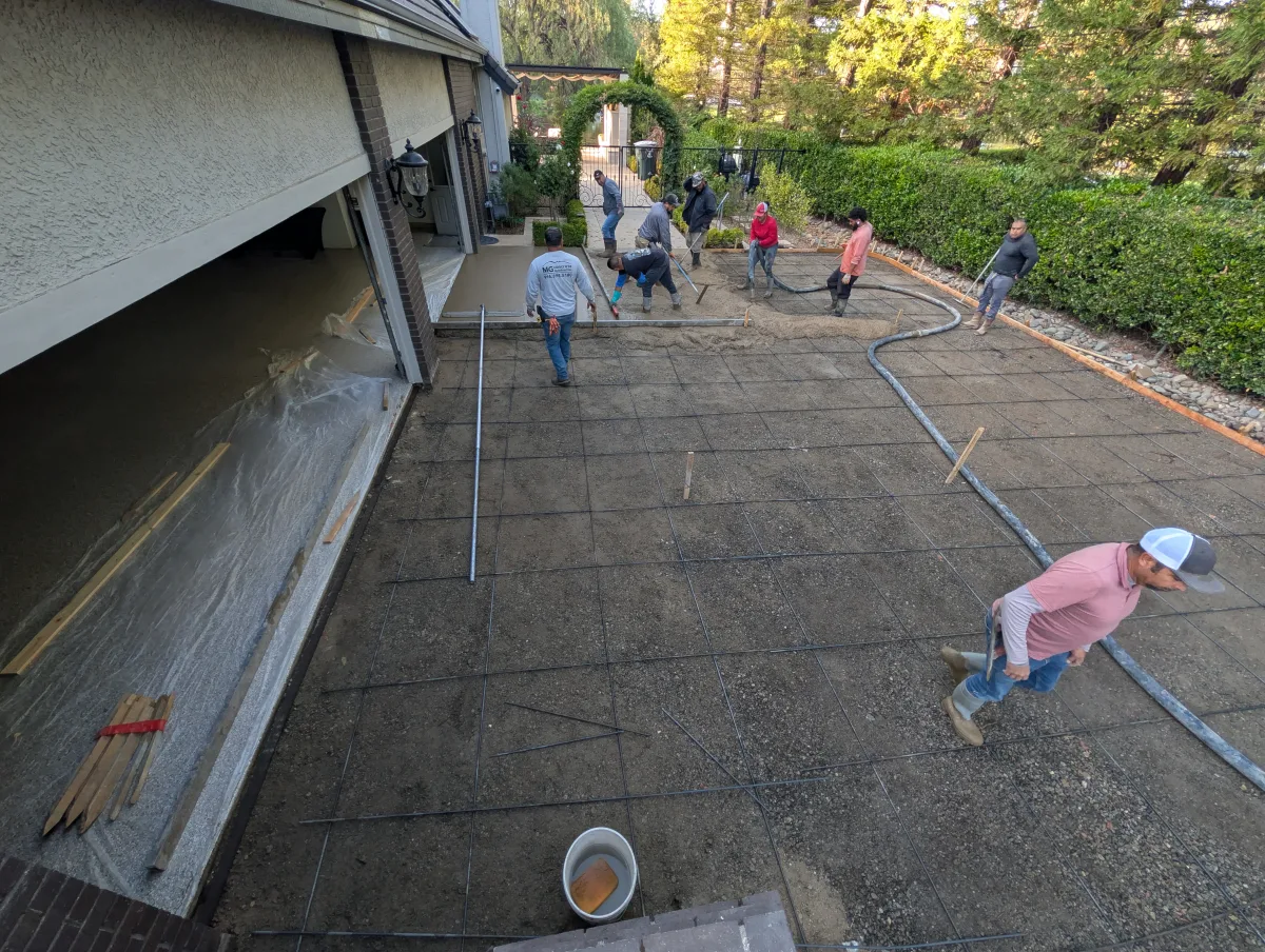 MG Concrete crew placing concrete at the same property on September 17, 2026